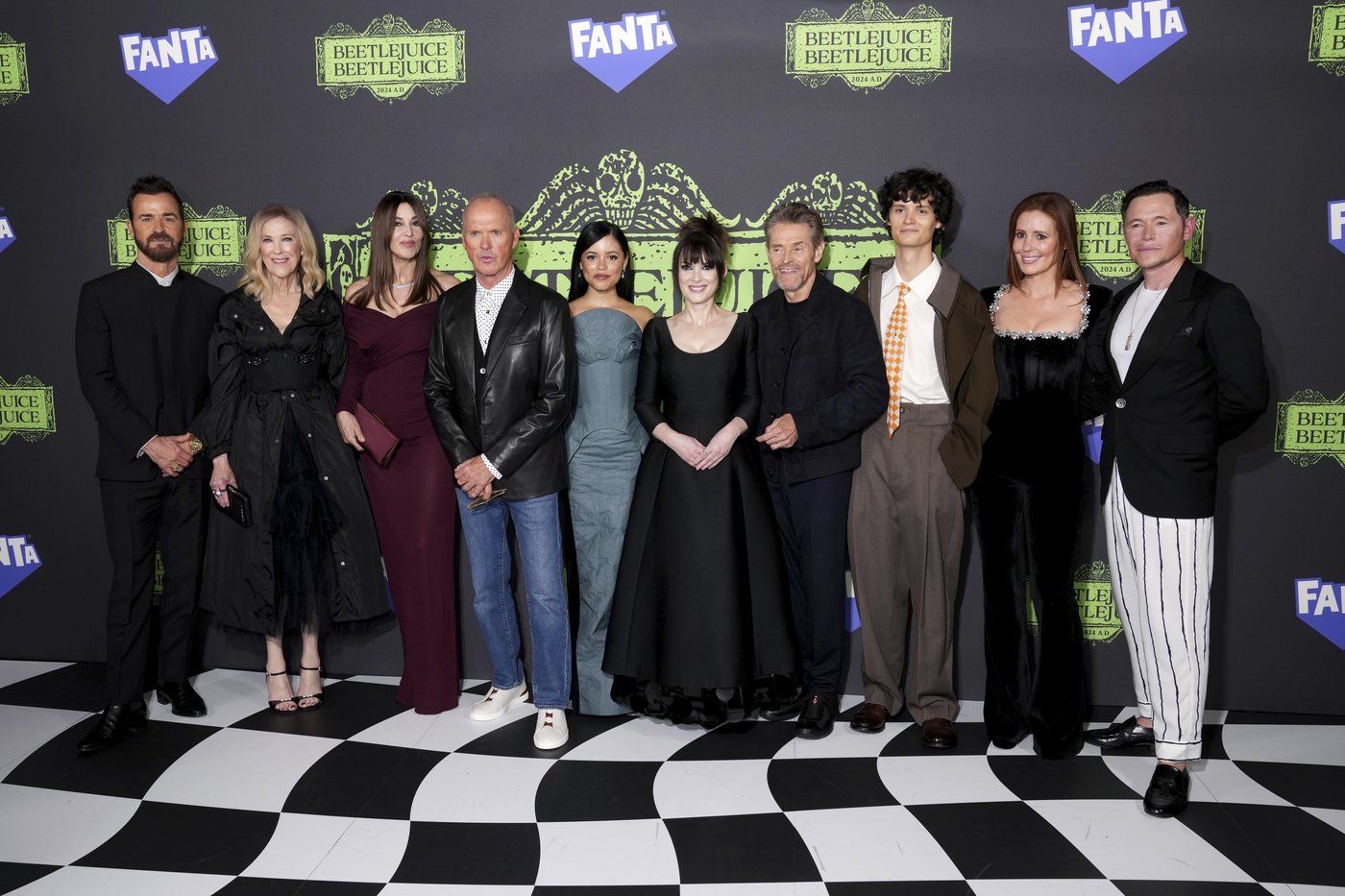 Justin Theroux, from left, Catherine O'Hara, Monica Bellucci, Michael Keaton, Jenna Ortega, Winona Ryder, Willem Dafoe, Arthur Conti, Amy Nuttall, and Burn Gorman arrive at the premiere of "Beetlejuice Beetlejuice" on Thursday, Aug. 29, 2024, in London. (Photo by Scott A Garfitt/Invision/AP)