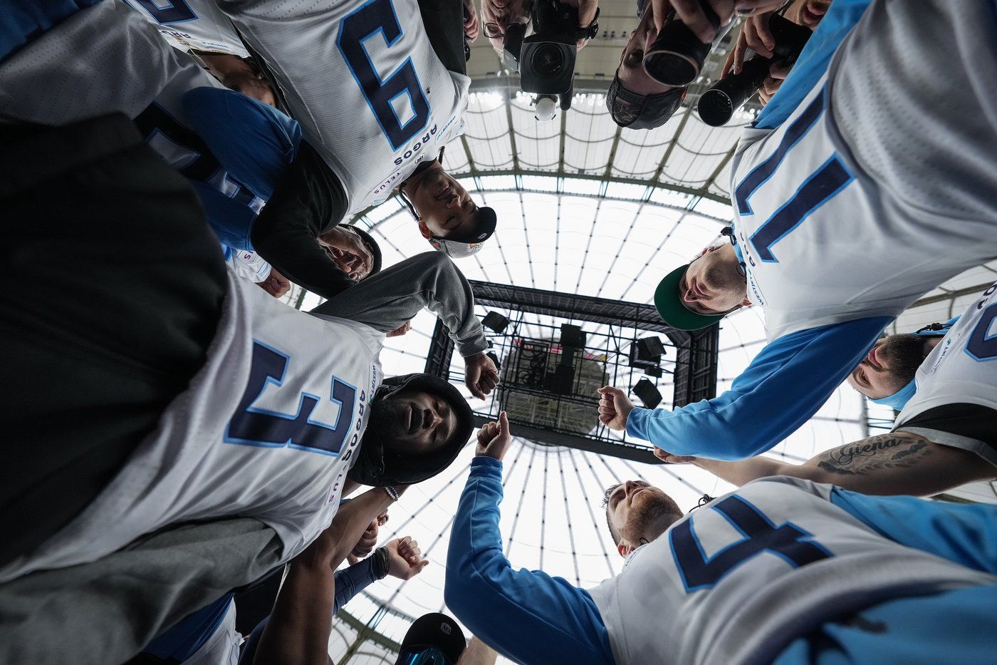 Toronto Argonauts quarterback Nick Arbuckle (4), Janarion Grant (3), Royce Metchie (9) and quarterback Cameron Dukes (11) huddle together with their teammates after a walkthrough ahead of the 111th CFL Grey Cup, in Vancouver, on Saturday, November 16, 2024. THE CANADIAN PRESS/Darryl Dyck