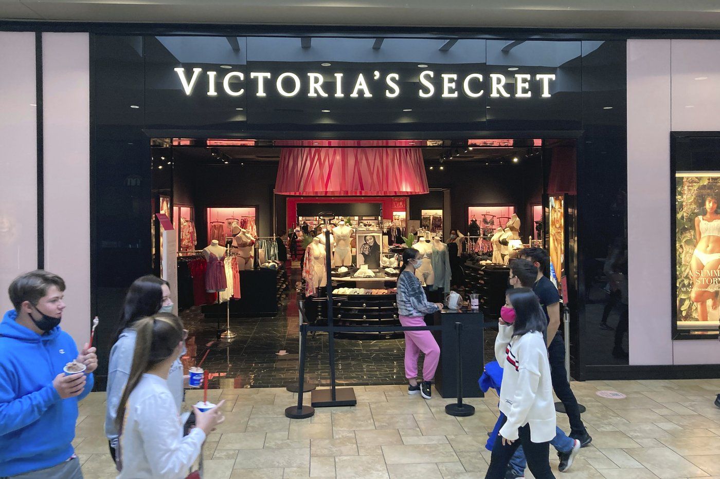 FILE - Shoppers pass a Victoria's Secret store at a shopping mall in Scranton, Pa., May 3, 2021. (AP Photo/Ted Shaffrey, file)